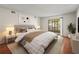 Well-lit bedroom with neutral tones, carpet, and sliding glass doors to the outside at 9804 Lombard Ct # 104, Tampa, FL 33618