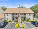 Exterior shot of a charming condo building with balcony and convenient parking at 9804 Lombard Ct # 104, Tampa, FL 33618