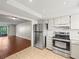 Modern kitchen open to the living room boasts stainless steel appliances at 9804 Lombard Ct # 104, Tampa, FL 33618