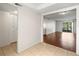 Bright living room features sleek wood floors and sliding glass doors to the outside at 9804 Lombard Ct # 104, Tampa, FL 33618
