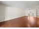 Open-concept living room boasts wood floors and seamless access to the kitchen at 9804 Lombard Ct # 104, Tampa, FL 33618
