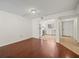 Open-concept living room with tile flooring in kitchen and wood floors at 9804 Lombard Ct # 104, Tampa, FL 33618