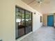 Covered patio with tile flooring, ceiling fan and sliding glass doors leading inside at 9804 Lombard Ct # 104, Tampa, FL 33618