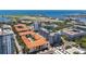 An aerial view showing the buildings of the community near the water, with airport in the background at 100 4Th S Ave # 312, St Petersburg, FL 33701