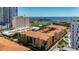 High angle shot of apartment buildings, the ocean, a park, and buildings in the distance at 100 4Th S Ave # 312, St Petersburg, FL 33701