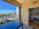 Balcony featuring a table, chairs, and views of palm trees and nearby buildings at 100 4Th S Ave # 312, St Petersburg, FL 33701