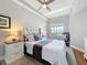 Bedroom featuring a ceiling fan, a queen-sized bed and soft natural lighting at 100 4Th S Ave # 312, St Petersburg, FL 33701