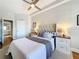 Bright bedroom featuring two nightstands and decor with a 