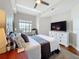 Bedroom featuring a queen-sized bed and a large dresser with a television at 100 4Th S Ave # 312, St Petersburg, FL 33701