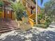 Colorful stairs lead to building with lush landscaping and architectural details at 100 4Th S Ave # 312, St Petersburg, FL 33701