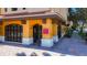 Inviting building entrance with warm colors, decorative columns, and well-maintained landscaping at 100 4Th S Ave # 312, St Petersburg, FL 33701