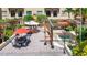 Expansive courtyard featuring covered seating areas, a spa, and outdoor dining sets at 100 4Th S Ave # 312, St Petersburg, FL 33701