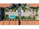A view of a pool, patio, courtyard and fountain surrounded by buildings with terracotta tiled roofs at 100 4Th S Ave # 312, St Petersburg, FL 33701
