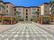 Symmetrical courtyard with fountain, trellis system, and matching seating areas at 100 4Th S Ave # 312, St Petersburg, FL 33701