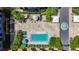 An aerial view of a courtyard with a pool and seating areas under a blue umbrella at 100 4Th S Ave # 312, St Petersburg, FL 33701