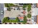 A drone shot of a courtyard with a fountain, pool, patio and lounge areas surrounded by lush trees at 100 4Th S Ave # 312, St Petersburg, FL 33701