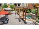 Open-air courtyard featuring trellis structures, a hot tub, and outdoor seating at 100 4Th S Ave # 312, St Petersburg, FL 33701