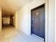 Neutral hallway leads to door to unit 317 at 100 4Th S Ave # 312, St Petersburg, FL 33701