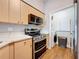 Modern kitchen boasts stainless steel appliances and a convenient laundry area at 100 4Th S Ave # 312, St Petersburg, FL 33701