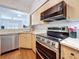 Bright kitchen with stainless steel appliances, a wine rack, and an open view to the living area at 100 4Th S Ave # 312, St Petersburg, FL 33701