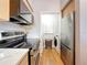 Modern kitchen with stainless steel appliances and adjacent laundry area at 100 4Th S Ave # 312, St Petersburg, FL 33701