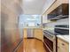 Modern kitchen with stainless steel appliances and a partial view to the living area at 100 4Th S Ave # 312, St Petersburg, FL 33701