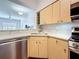 Bright kitchen with modern cabinetry, quartz countertop and stainless steel appliances at 100 4Th S Ave # 312, St Petersburg, FL 33701