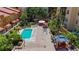 Overhead shot of the community pool with lounge area, lush landscaping, and patio at 100 4Th S Ave # 312, St Petersburg, FL 33701