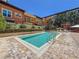 Relaxing community pool surrounded by brick pavers and lush landscaping at 100 4Th S Ave # 312, St Petersburg, FL 33701