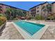 Community swimming pool surrounded by tropical landscaping and seating areas at 100 4Th S Ave # 312, St Petersburg, FL 33701