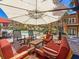Outdoor pool area with comfortable seating and large umbrellas for shade at 100 4Th S Ave # 312, St Petersburg, FL 33701