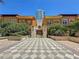 Elegant townhomes with patterned brick drive, gate, and tropical landscaping enhance curb appeal at 100 4Th S Ave # 312, St Petersburg, FL 33701