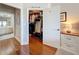 Well-organized walk-in closet featuring ample storage and hardwood floors, located near an ensuite bathroom at 100 4Th S Ave # 312, St Petersburg, FL 33701