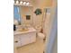 Bathroom with white vanity, basin sink, and colorful shower with sea themed accents at 100 Bluff View Dr # 308A, Belleair Bluffs, FL 33770