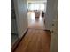 Living room view featuring hardwood floors and doorway to full living area and windows at 100 Bluff View Dr # 308A, Belleair Bluffs, FL 33770