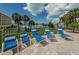 A luxurious pool deck with comfy lounge chairs is the perfect place to relax by the pool and enjoy the beautiful view at 100 Bluff View Dr # 308A, Belleair Bluffs, FL 33770