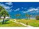 Lush lawn with walkway and water access at 100 Bluff View Dr # 308A, Belleair Bluffs, FL 33770