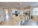 Modern kitchen featuring stainless steel appliances, granite countertops, a center island, and ample cabinet space at 10586 Buttercup Ct, Venice, FL 34293