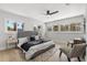 Bright bedroom featuring multiple windows, neutral walls, and a ceiling fan at 109 13Th St, Belleair Beach, FL 33786