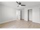 Clean bedroom with wood-look tile floors, closet, and ample space at 109 13Th St, Belleair Beach, FL 33786