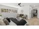 Light-filled bedroom with a ceiling fan, large windows, and stylish decor at 109 13Th St, Belleair Beach, FL 33786