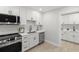 Bright kitchen with new stainless steel appliances, shaker cabinets, and modern faucet at 109 13Th St, Belleair Beach, FL 33786