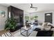Bright living room with modern fireplace, stylish furniture, and large windows at 109 13Th St, Belleair Beach, FL 33786