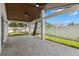 Covered outdoor patio features a wood ceiling, tile floor, and ceiling fans at 109 13Th St, Belleair Beach, FL 33786