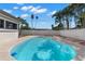 Sparkling private pool surrounded by lush tropical landscaping and a privacy fence at 109 13Th St, Belleair Beach, FL 33786
