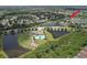 Aerial view showcasing the community, nearby ponds, and amenities, highlighting its desirable location and features at 11336 Callaway Pond Dr, Riverview, FL 33579