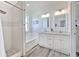 This bathroom showcases a dual sink vanity with a separate tub and shower for a spa-like retreat at 11336 Callaway Pond Dr, Riverview, FL 33579