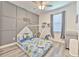 This bedroom features a patterned wall and a tent bed with space to play at 11336 Callaway Pond Dr, Riverview, FL 33579