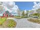 A large playground and picnic pavilion with paved walkways and mature trees offers outdoor recreation at 11336 Callaway Pond Dr, Riverview, FL 33579