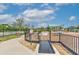 Fenced community playground featuring modern equipment, walking path and beautiful landscaping for Gathering enjoyment at 11336 Callaway Pond Dr, Riverview, FL 33579